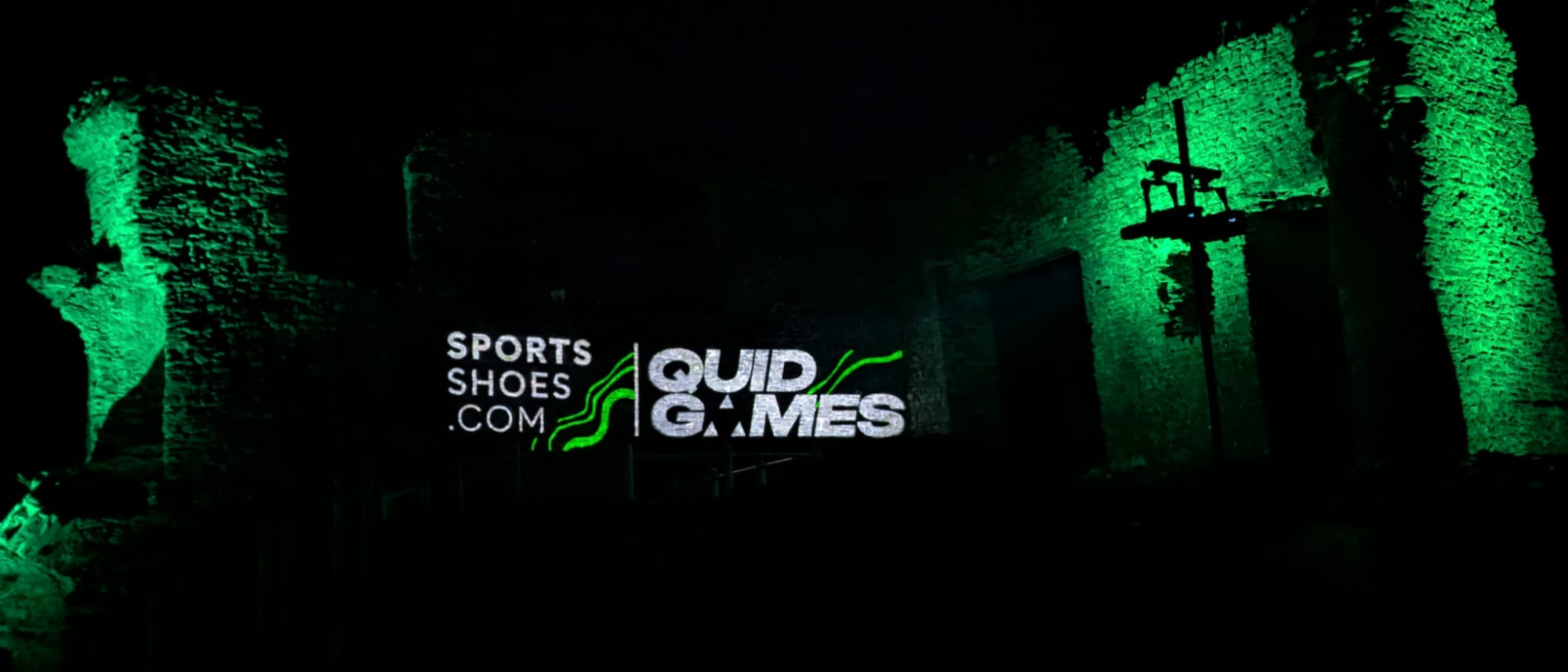 Quid Games logo projected on Kendal Castle